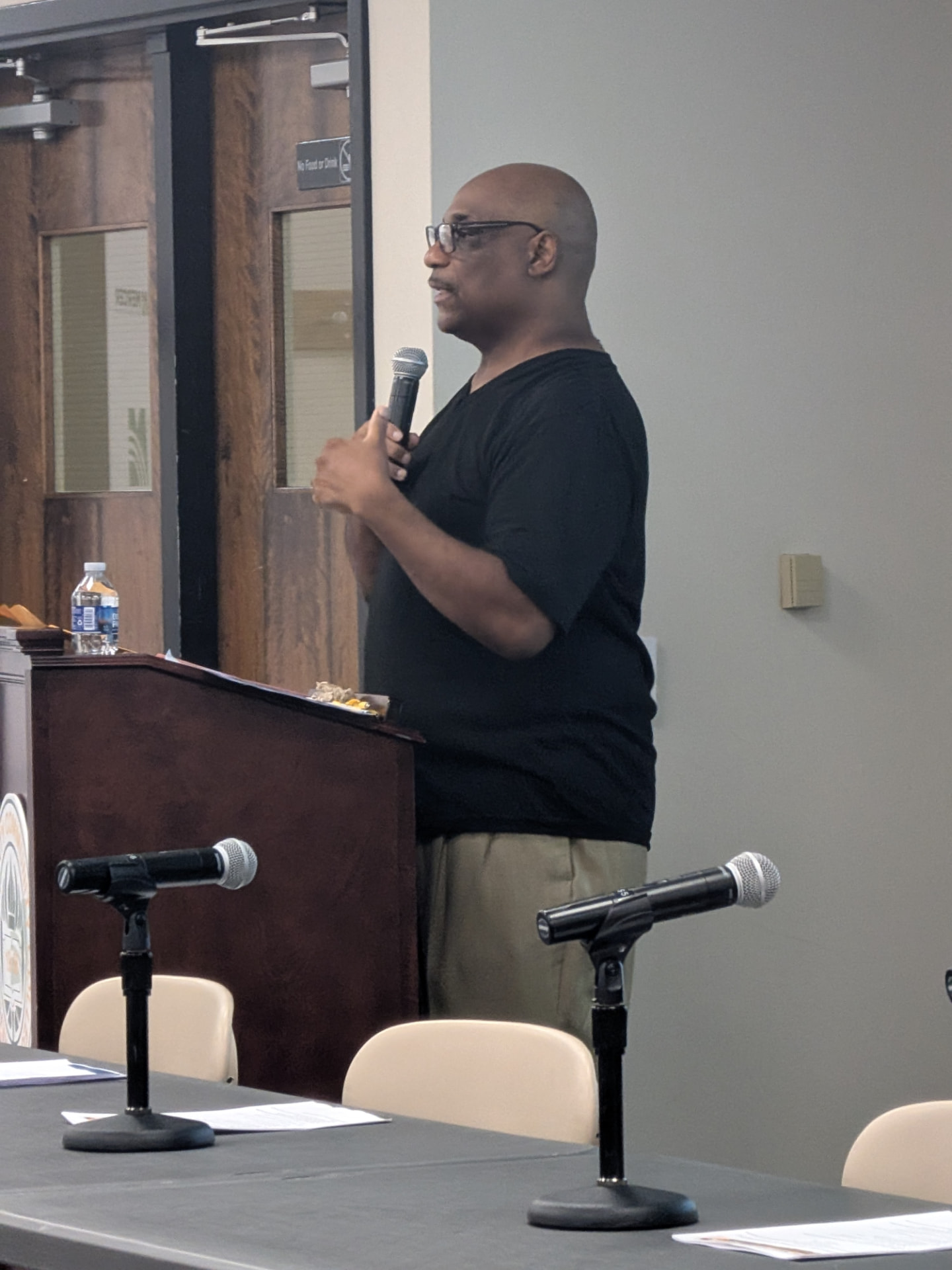 Organizer speaking to attendees at the Trenton Transformation gathering